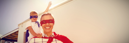 Mother and son playing super heroesの写真素材