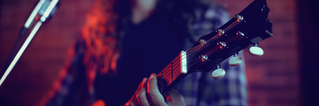 Low angle view of male singer performing in nightclubの写真素材