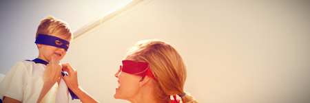 Mother and son playing super heroesの写真素材