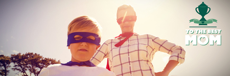 mothers day greeting against mother and son playing super heroesの写真素材