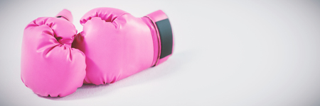 Pink gloves on white backgroundの写真素材