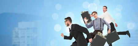 Digital composite of Business people running and City buildings with flare light sourceの写真素材