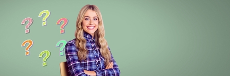 Digital composite of Woman thinking with colorful funky question marksの写真素材