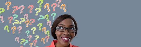 Digital composite of Woman with colorful funky question marks emerging from headの写真素材