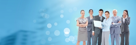 Digital composite of Business people and City buildings with flare light sourceの写真素材