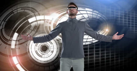 Digital composite of Virtual reality headset man with Glowing circle technology interfaceの写真素材