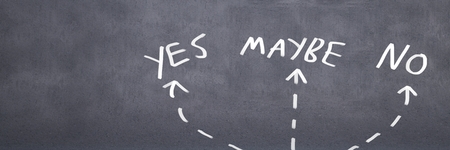 Digital composite of Yes No Maybe with arrows graphic on wall