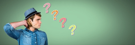 Digital composite of Man thinking with colorful funky question marksの写真素材