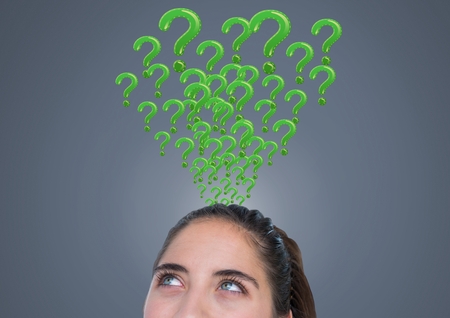 Digital composite of Woman with grey question marks emerging from headの写真素材