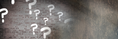 Digital composite of question marks and cracked old wallの写真素材