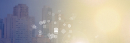 Digital composite of City buildings with flare light sourceの写真素材