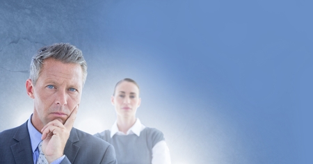 Digital composite of Business people thinking decisively with blue backgroundの写真素材