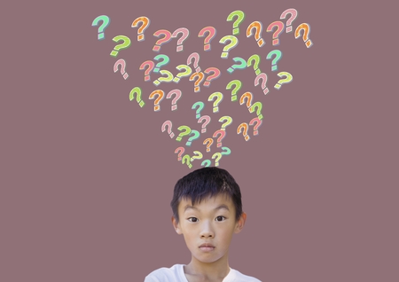 Digital composite of Kid Boy with colorful funky question marksの写真素材