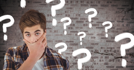 Digital composite of Man thinking with question marks and cracked old wallの写真素材