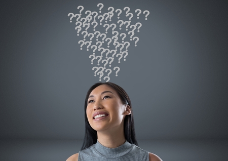 Digital composite of Woman with grey question marks emerging from headの写真素材