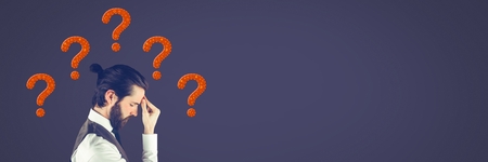 Digital composite of Man thinking with purple stitched question marksの写真素材