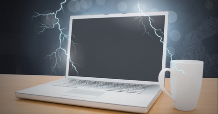 Digital composite of Laptop struck with lightning powerの写真素材