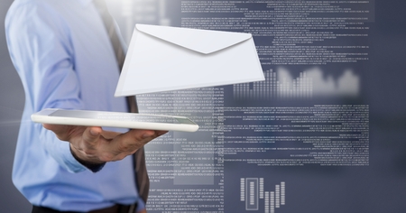 Digital composite of Envelope letter message and man using tabletの写真素材