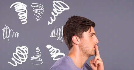 Digital composite of Man thinking with doodles on grey background