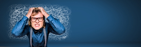 Digital composite of Stressed anxious man on computer with doodles scribbles on blue backgroundの写真素材