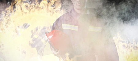 Serious Fireman against grey room