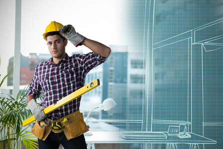 Confident Construction worker  against working desk in a office