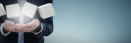 Businessman presenting object against abstract grey backgroundの写真素材