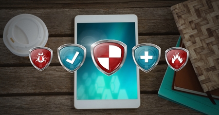 Digital composite of Antivirus security protection shields over tablet deviceの写真素材