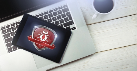 Digital composite of Bug and ransomware security protection shield on computer