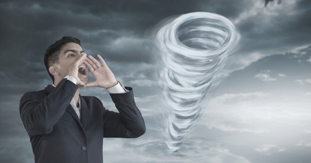 Digital composite of Tornado twister painted and dark sky with man shoutingの写真素材