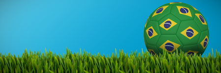 Grass growing outdoors against plain blue backgroundの写真素材