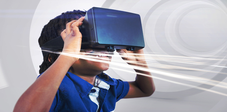 Boy wearing virtual reality simulator on white backgroundの写真素材