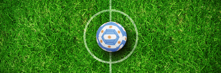 Football in argentinian colours against closed up view of grassの写真素材