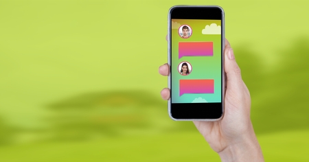 Digital composite of Messaging App on phone in hand with chat profilesの写真素材