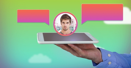 Digital composite of Hand holding tablet with chat bubble messaging profileの写真素材