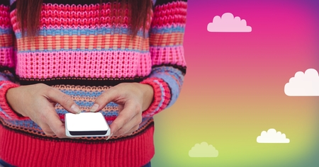 Digital composite of Woman using phone with cloudy background