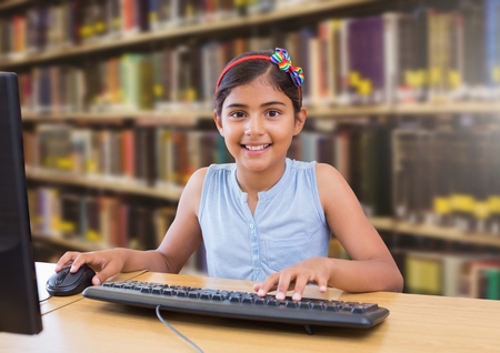 Digital composite of School girl in education libraryの写真素材