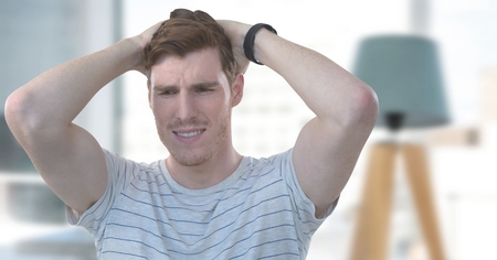 Digital composite of Man anxious and worried by window