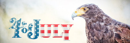 Independence day graphic against close up of golden eagle