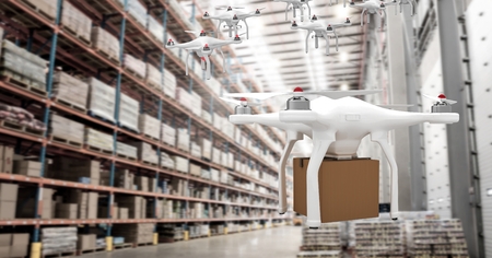 Digital composite of Drones flying in warehouse with delivery parcel boxの写真素材