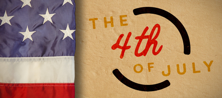 Creased US flag against colorful happy 4th of july text against white backgroundの写真素材