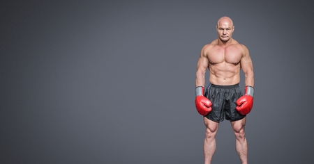 Digital composite of Male boxer with blank grey backgroundの写真素材