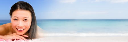 Digital composite of Happy spa woman relaxed with sea with transitionの写真素材