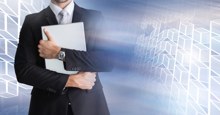 Digital composite of Man using laptop with geometric transitionの写真素材