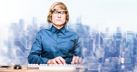 Digital composite of Man using computer with geometric transitionの写真素材