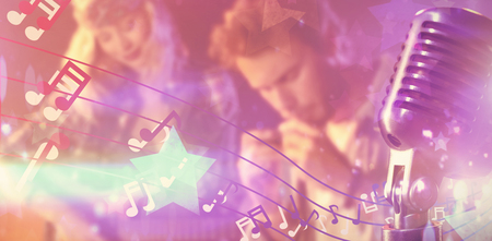 Close-up of microphone  against digitally generated cool nightlife design with starsの写真素材