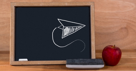 Digital composite of Paper airplane Education drawing on blackboard for schoolの写真素材
