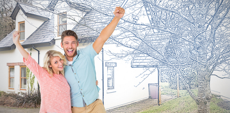 Attractive couple smiling and cheering against pretty house with a blue and white filterの写真素材