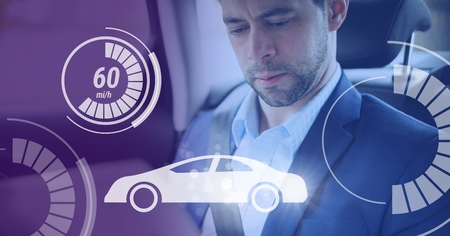 Digital composite of Man in driverless autonomous car with heads up display interfaceの写真素材