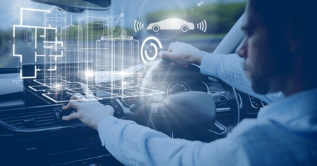 Digital composite of Man driving in car with heads up display interfaceの写真素材